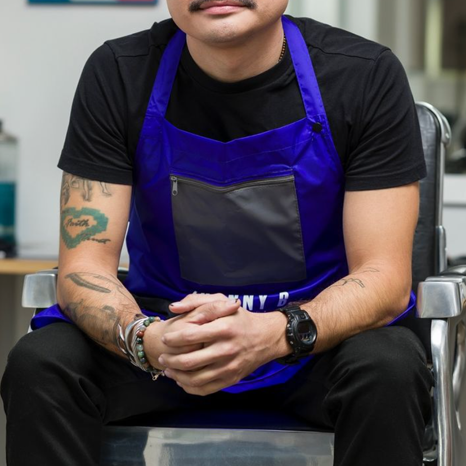 Barber wearing AOK Apron