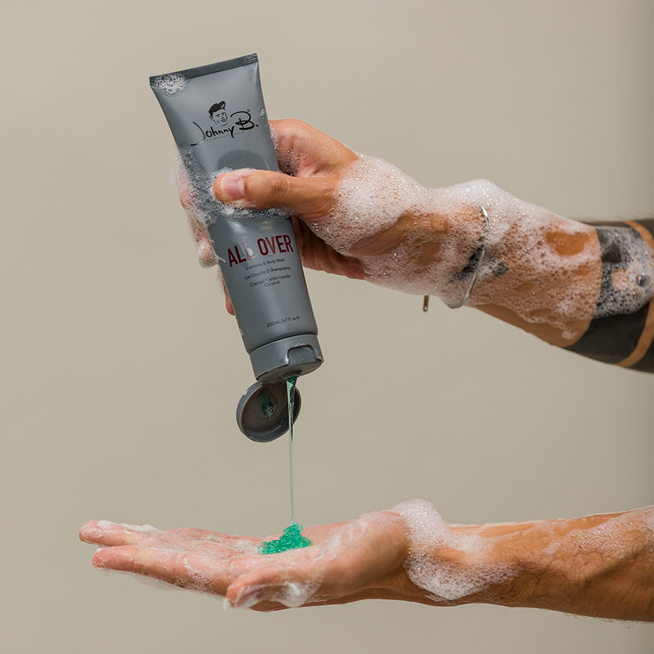 Man squeezing All Over 200ml in hands