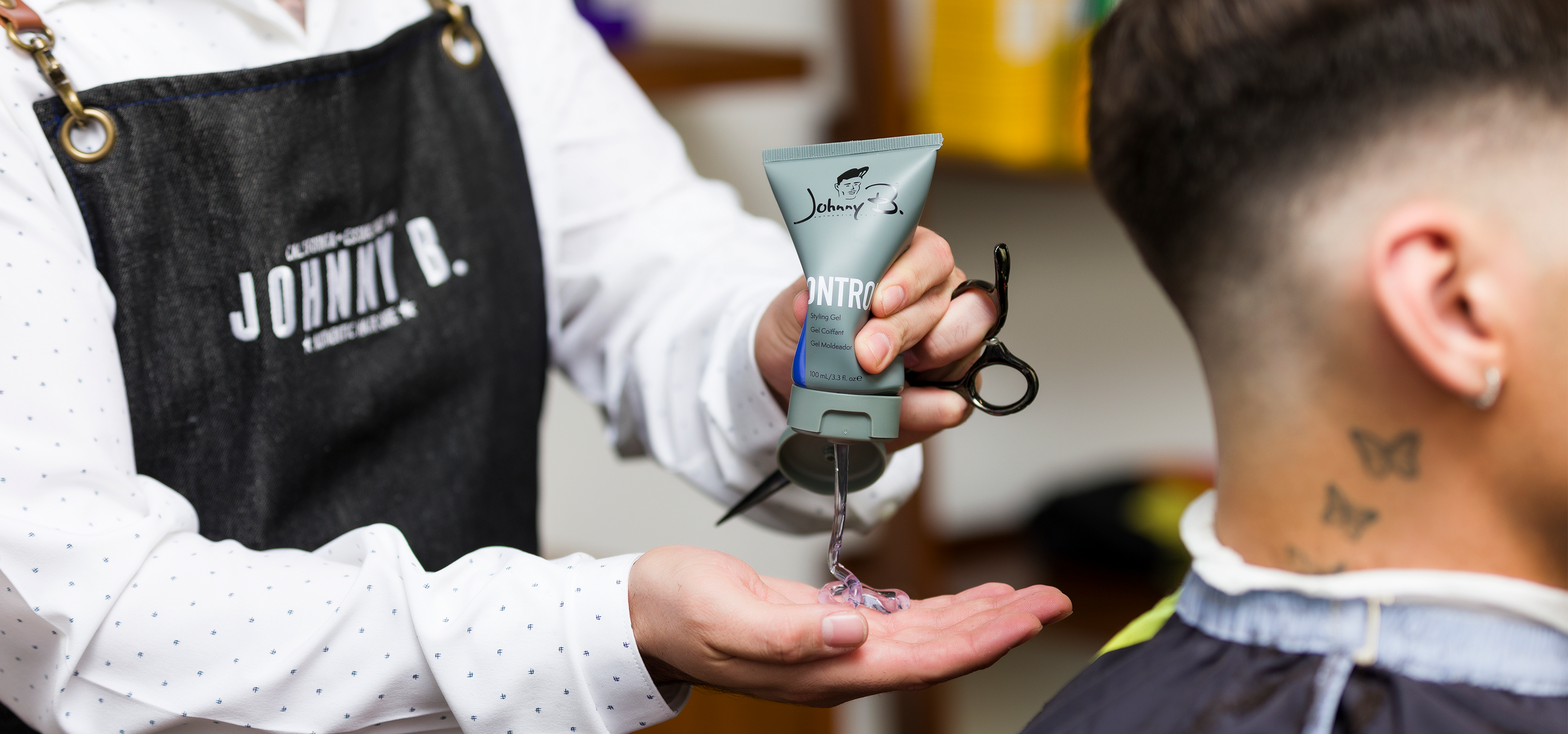 Barber squeezing Control 100ml in hands