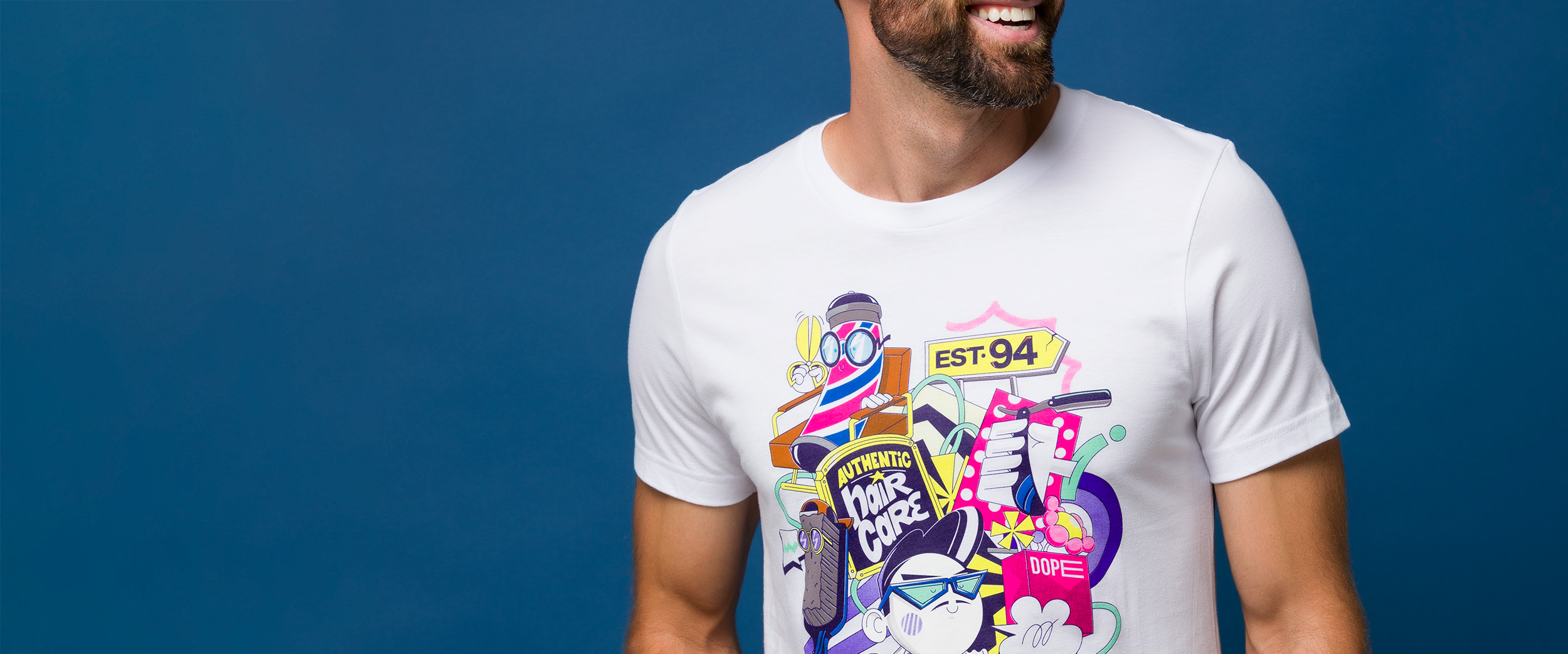 Man wearing a white t-shirt with colorful Johnny B. Graffiti artwork