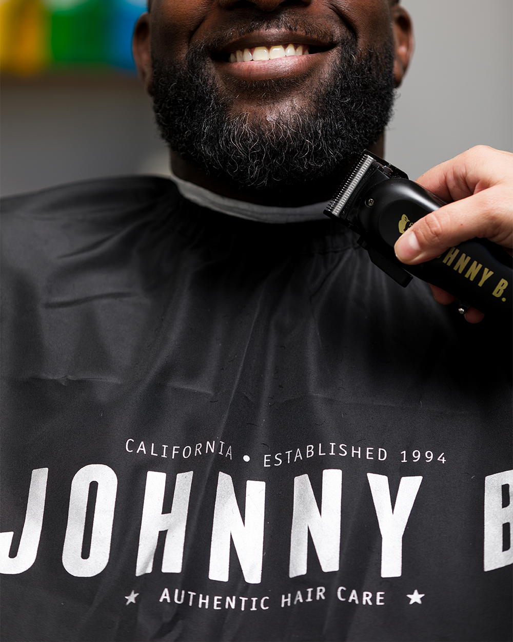 Man wearing Black cutting cape