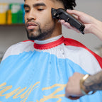 Client wearing Face Off Cutting Cape