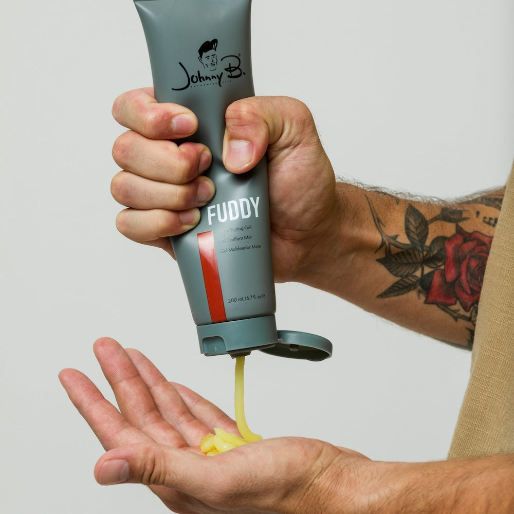 Man squeezing Fuddy into hands