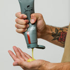 Man squeezing Fuddy into hands