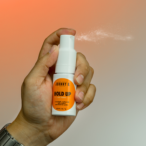Hold Up Hair Powder 9g packaging, misting out product from spray nozzle