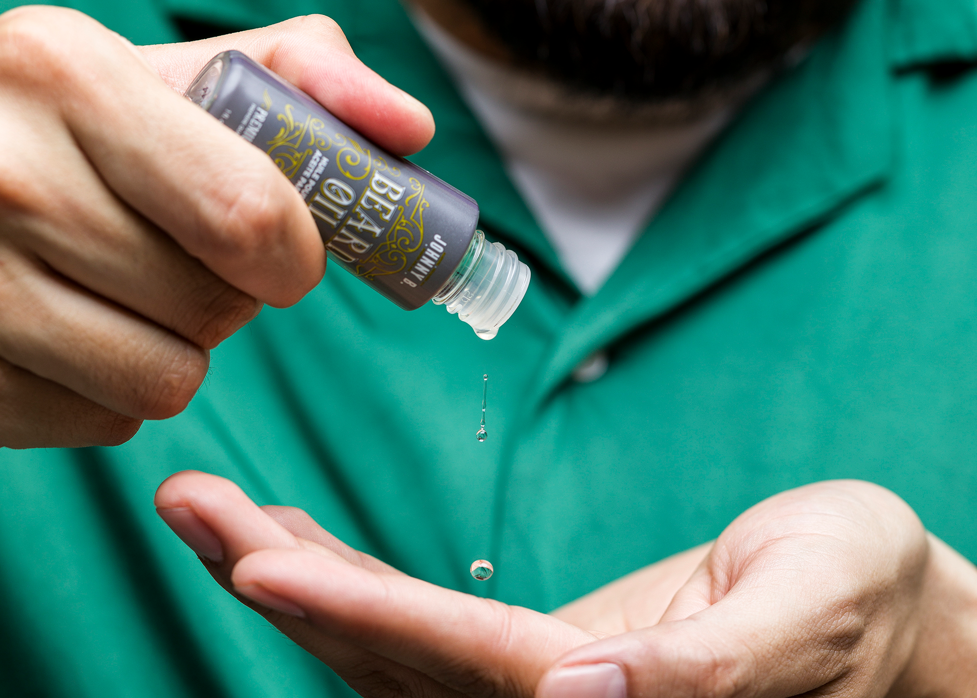 Man applying Beard Oil in hand
