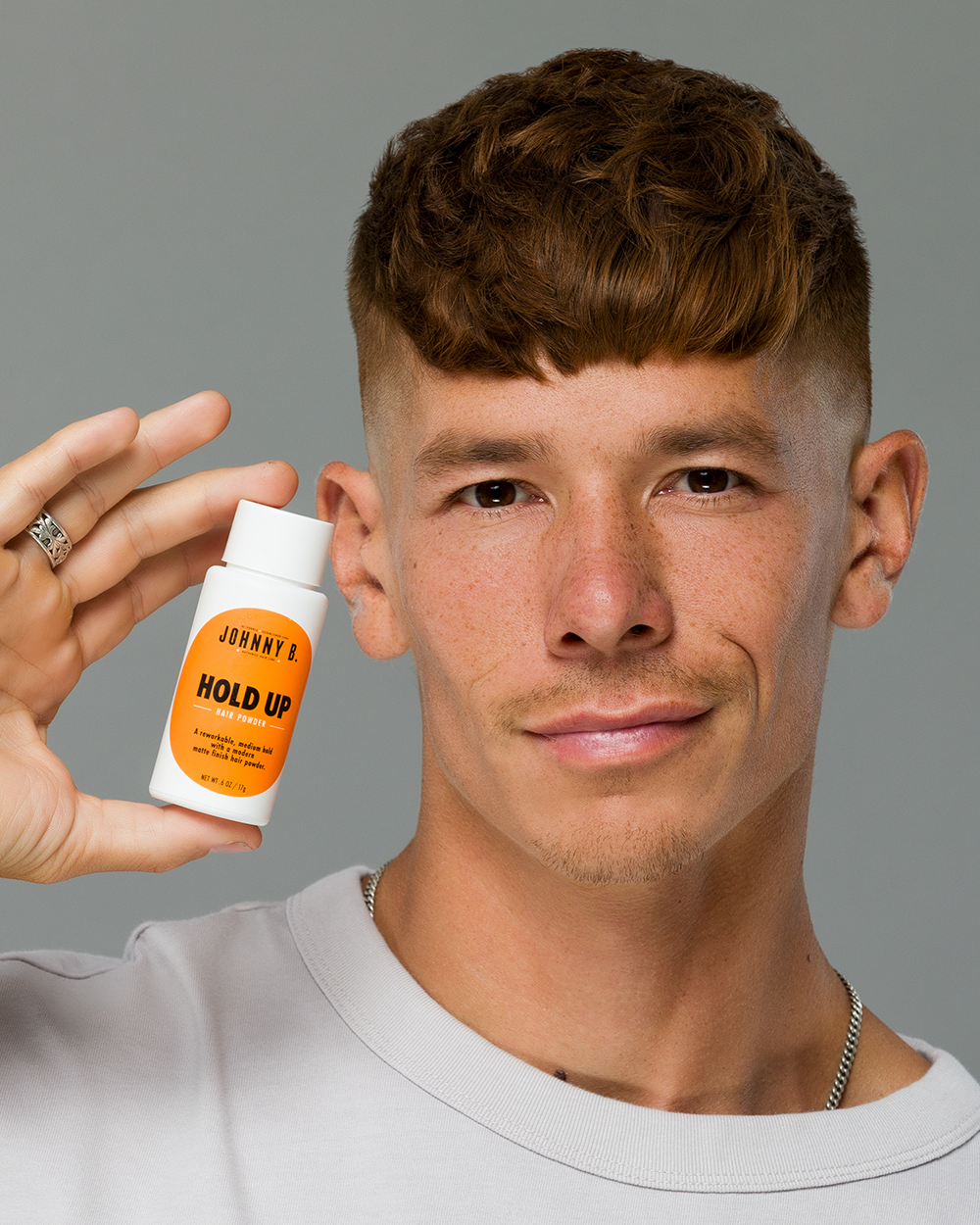 Man holding Hold Up Hair Powder in hair