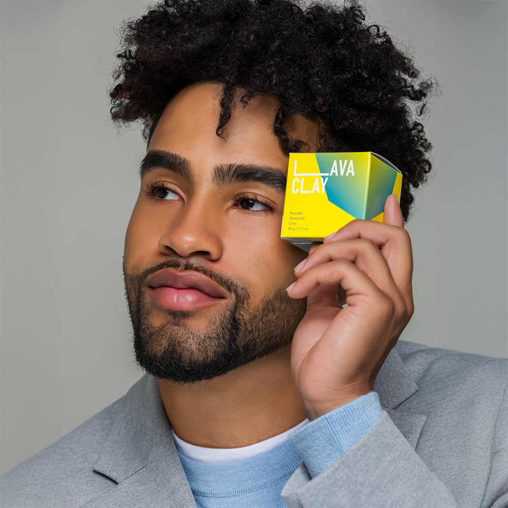 Model holding Lava Clay upto face