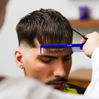 Barber cutting client's hair with Super Spreader Comb