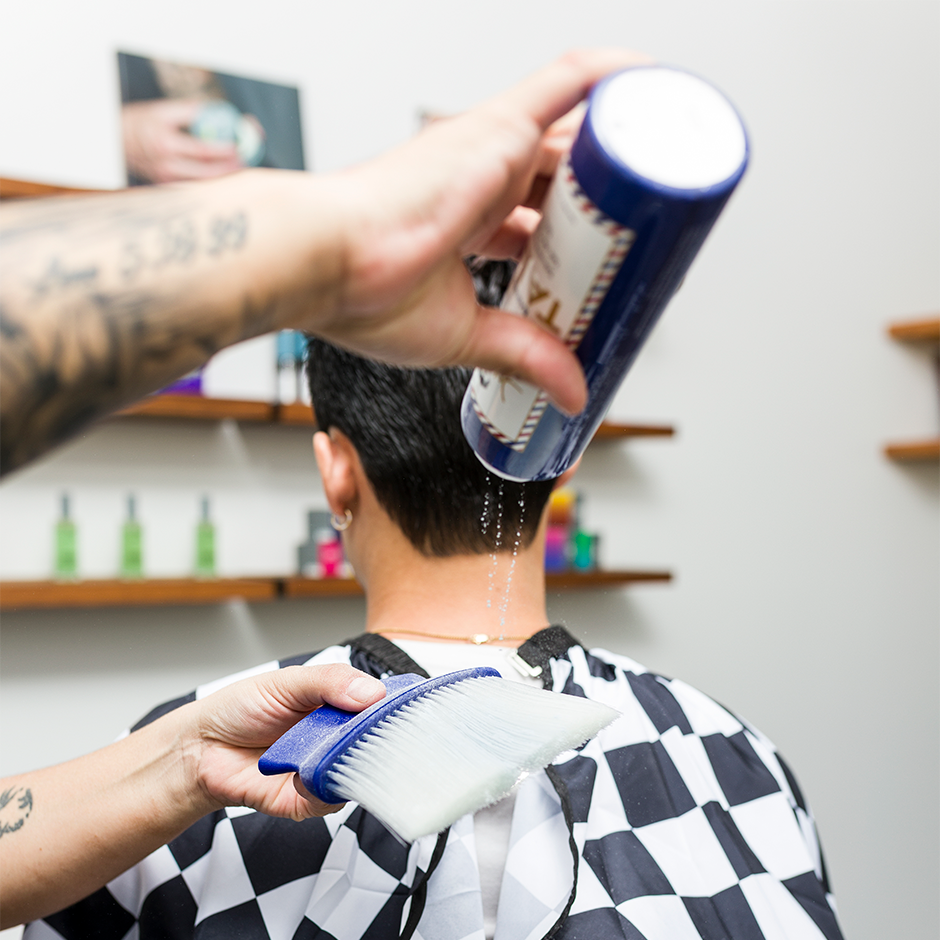 Barber applying Talc onto Neck Duster