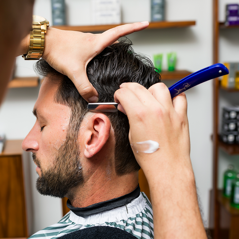 Barber using Razor to cut hair