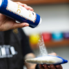 Barber using Talc Powder with Neck Duster