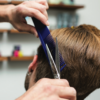 Barber using Texturizing Comb to cut hair