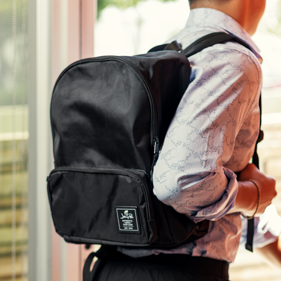 Man wearing Black Johnny B. Backpack