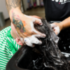 Barber applying Juniors Shampoo on child's hair