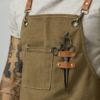 Closeup of Work Apron. Detailing includes a spot to place scissors