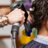 Barber using Vent Brush with blow drying tool