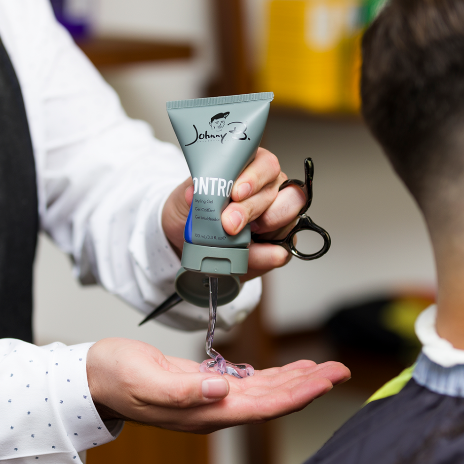 Barber squeezing Control Gel in palm